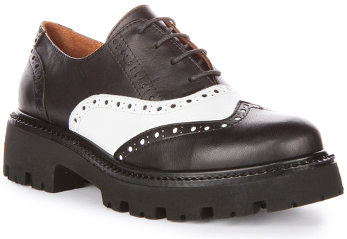 JUSTINREESS Millie Zapatos Oxford de cordones de piel para mujer en negro blanco