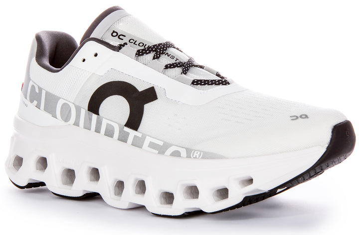 Chaussures de course emblématiques On Running Cloudmonster pour hommes avec technologie Cloudtec en blanc noir