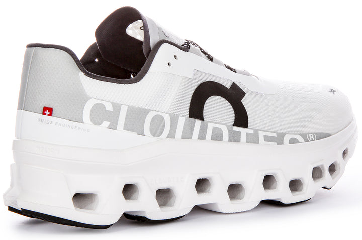 Chaussures de course emblématiques On Running Cloudmonster pour hommes avec technologie Cloudtec en blanc noir