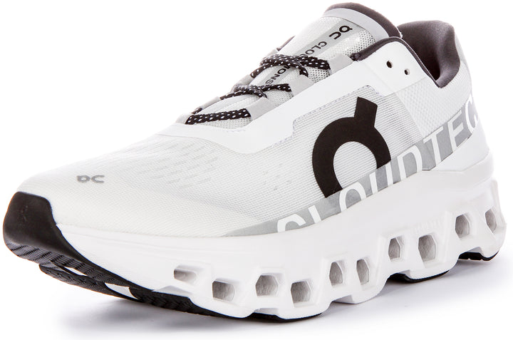 Chaussures de course emblématiques On Running Cloudmonster pour hommes avec technologie Cloudtec en blanc noir