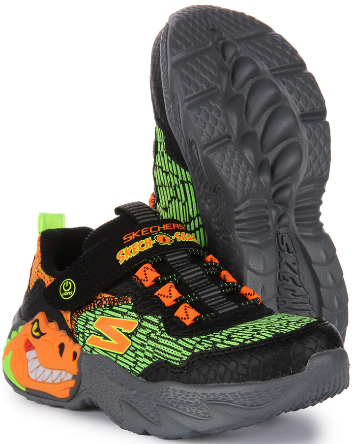 Skechers SkechOSaurusDinoLights Scarpe da ginnastica sintetiche a rete per bambini in nero arancione