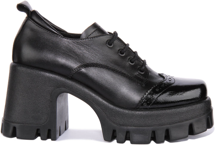 JUSTINREESS Lilly Zapatos brogue con cordones de piel para mujer en charol negro