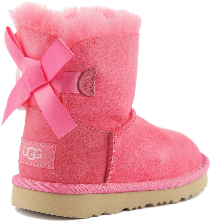 Ugg Mini Bailey Bow Bota de piel de oveja twinface para bebé en rosa