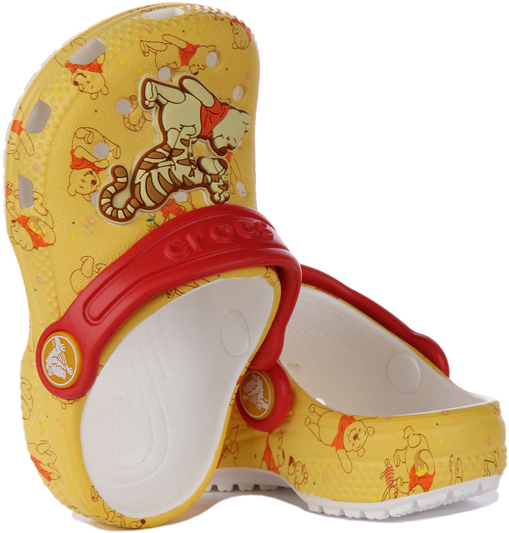 Crocs Classic Sandalia zueco Winnie The Pooh para niño en amarillo rojo